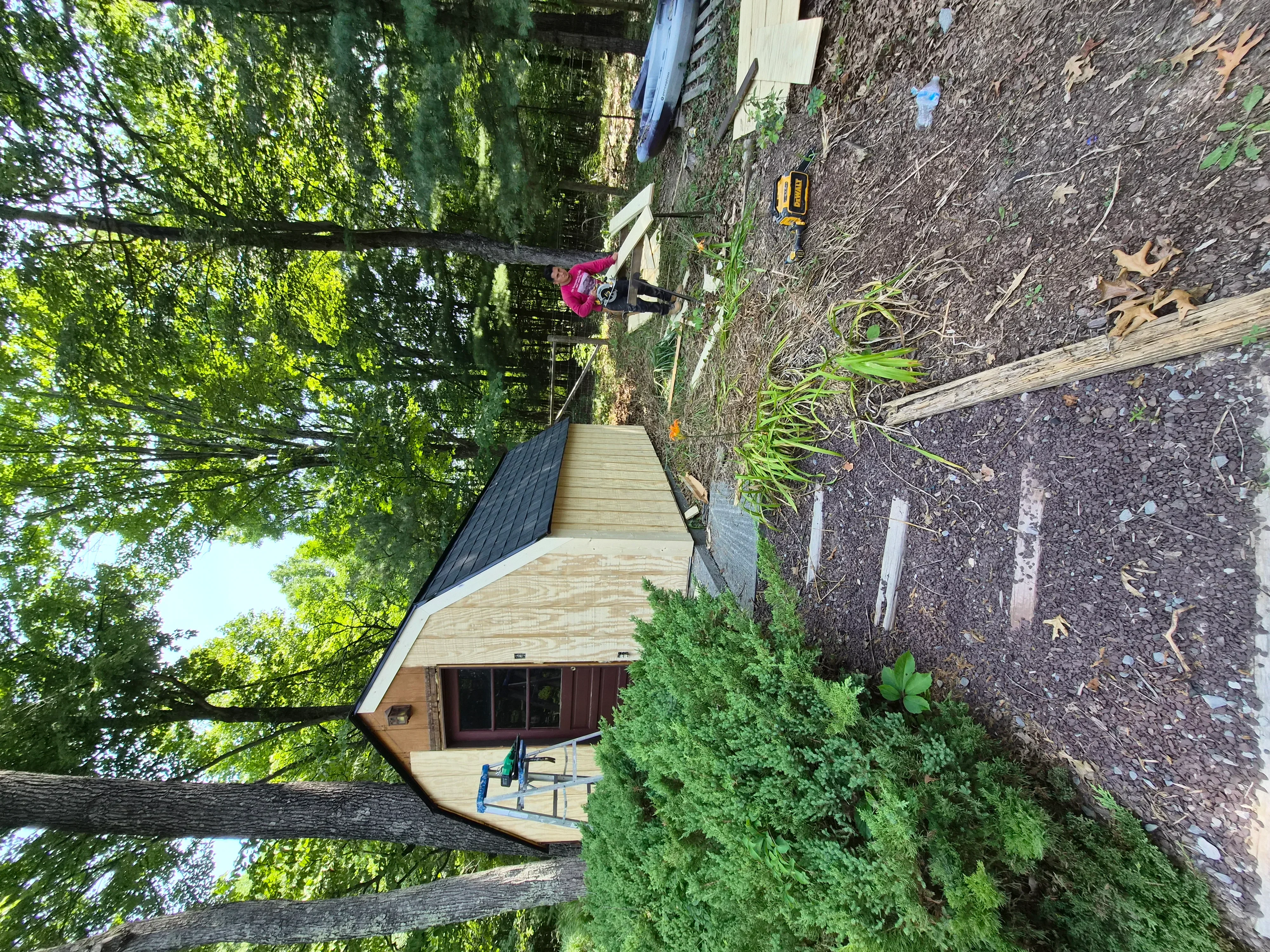 Wooden deck with fresh stain finish and painted exterior trim on residential home