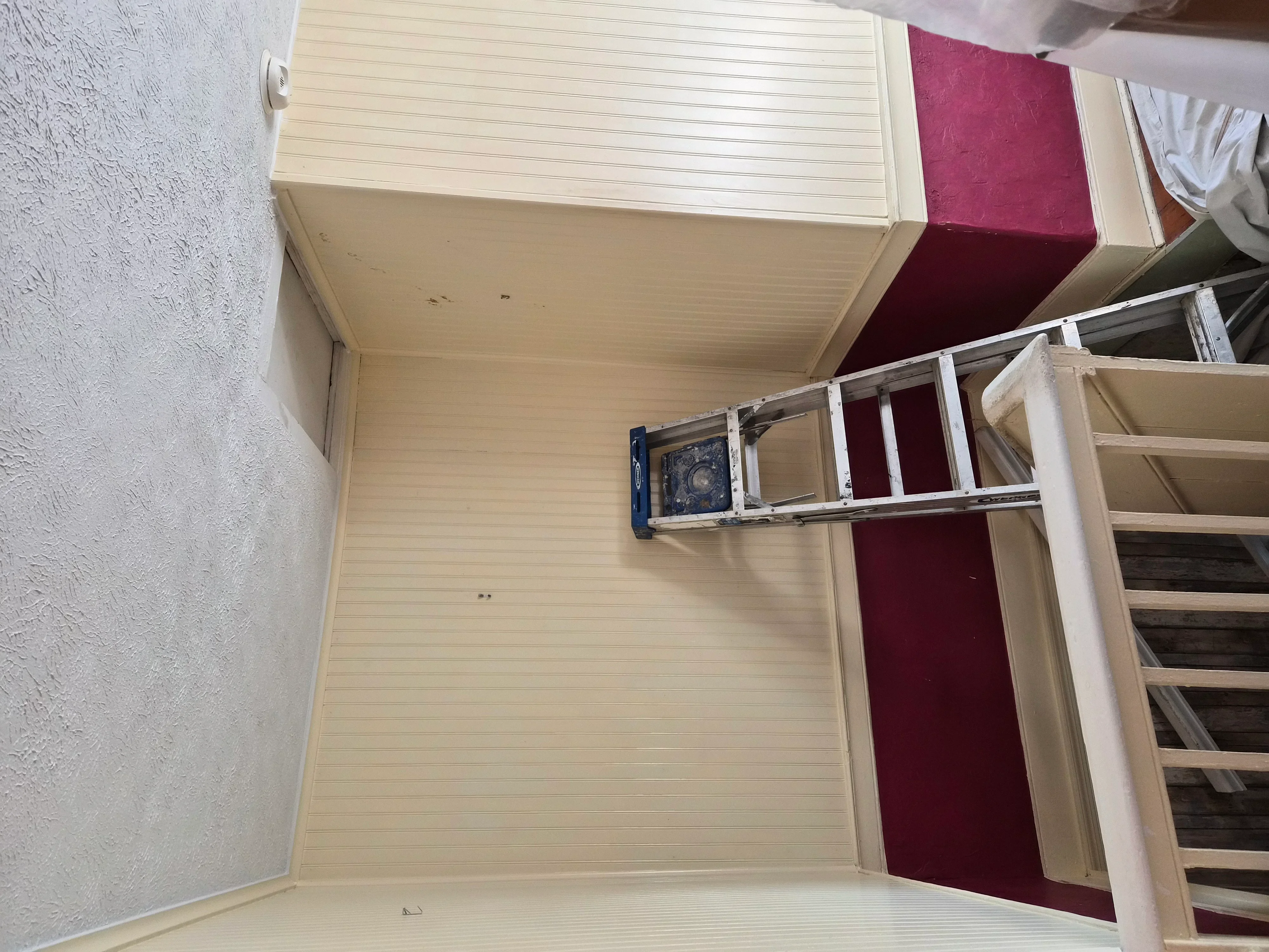 Freshly painted interior ceiling with beadboard texture and painted drywall walls