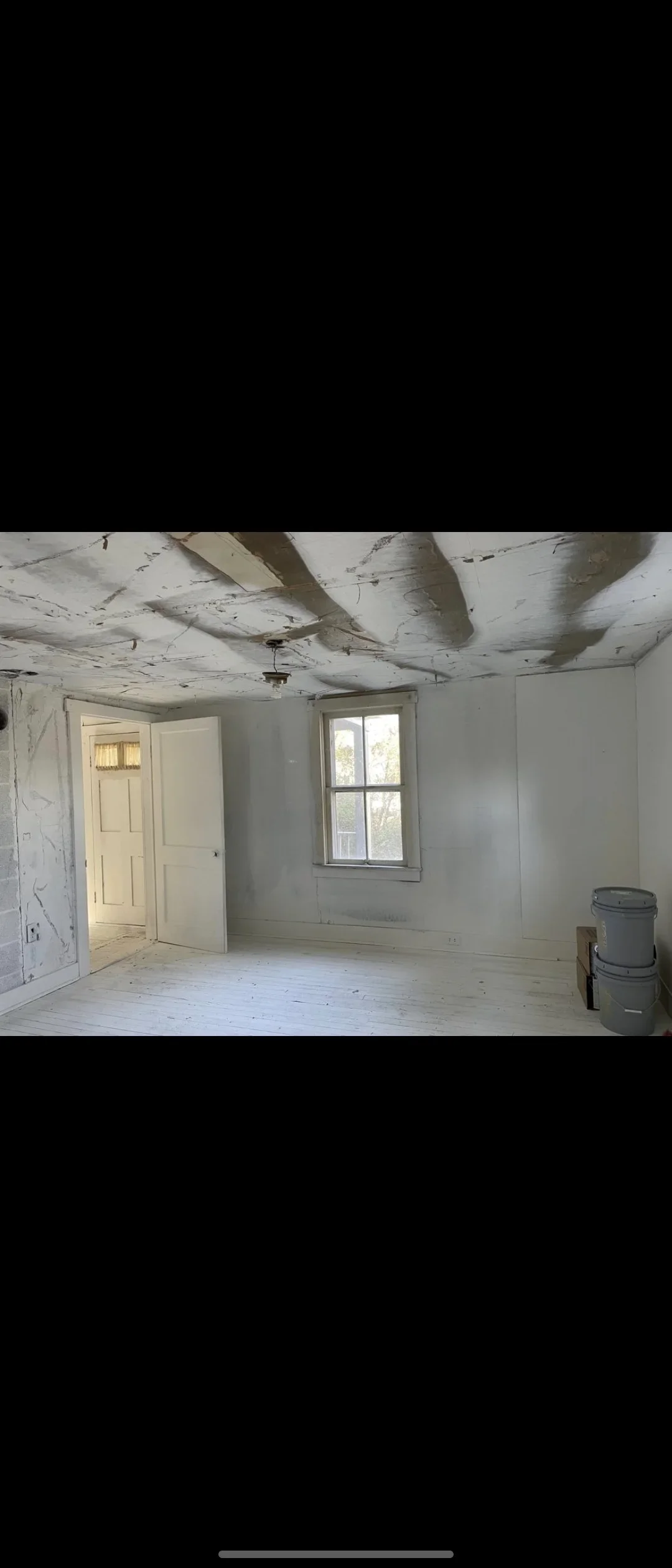 Interior room with installed drywall walls, textured ceiling, and primed surfaces ready for painting