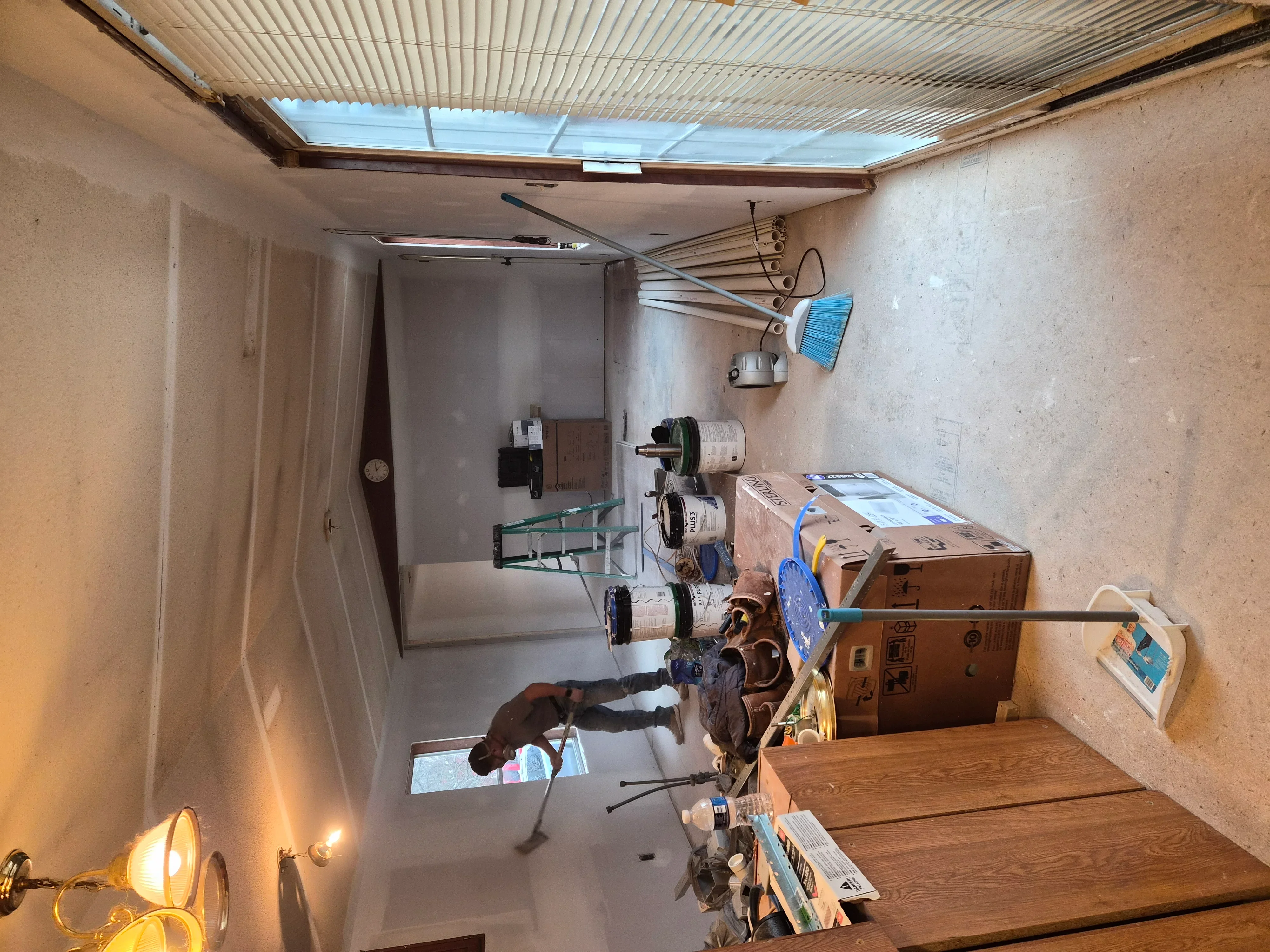 Newly painted garage interior with white drywall and corrugated metal ceiling panels