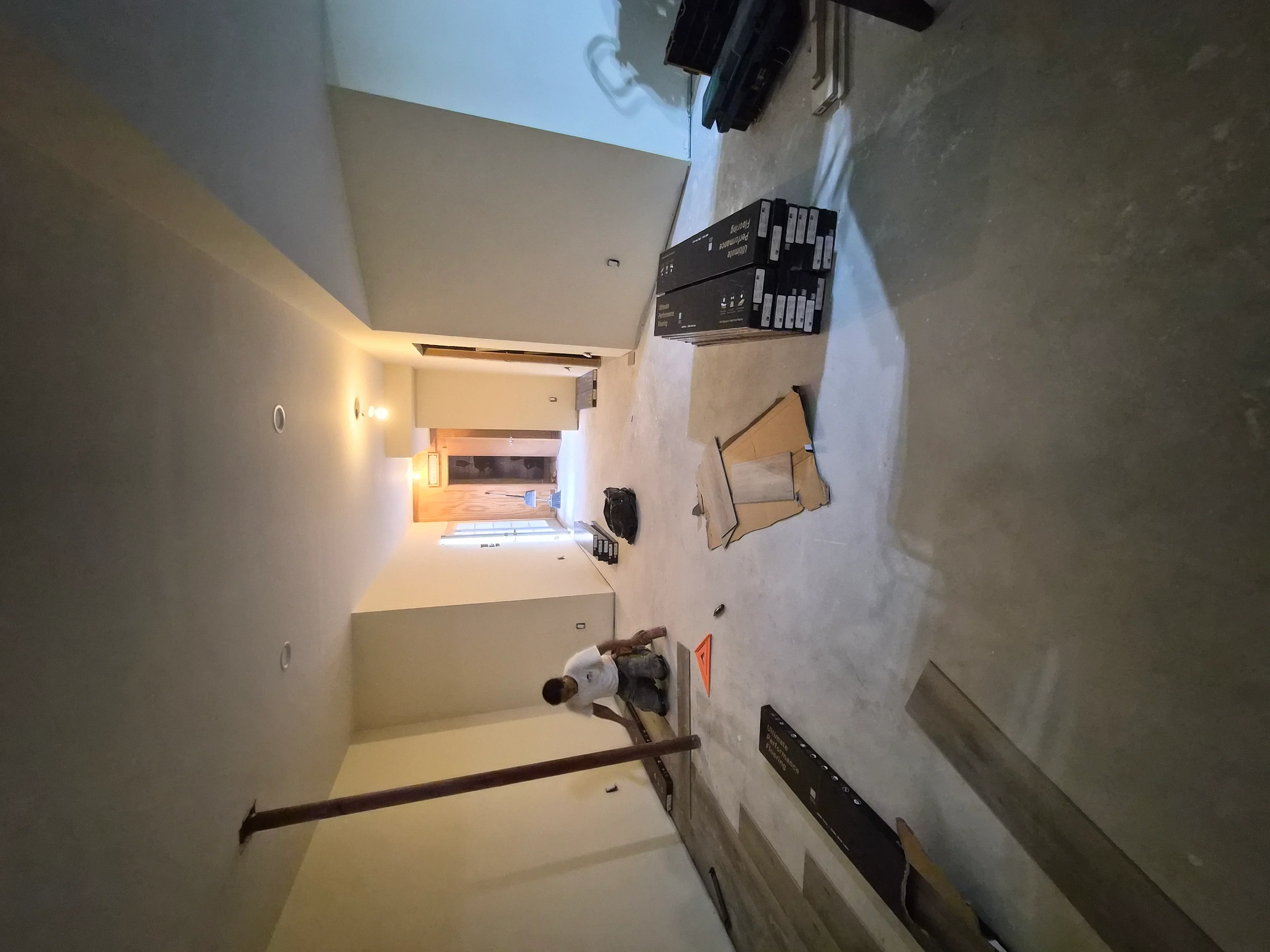 Drywall-finished interior room with smooth walls, primer coat, and professional paint application